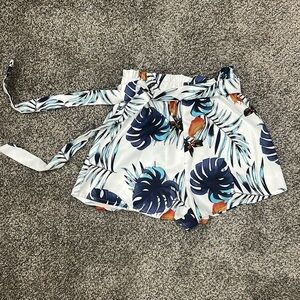 Tropical floral white and navy shorts size small. No tags. Never worn.